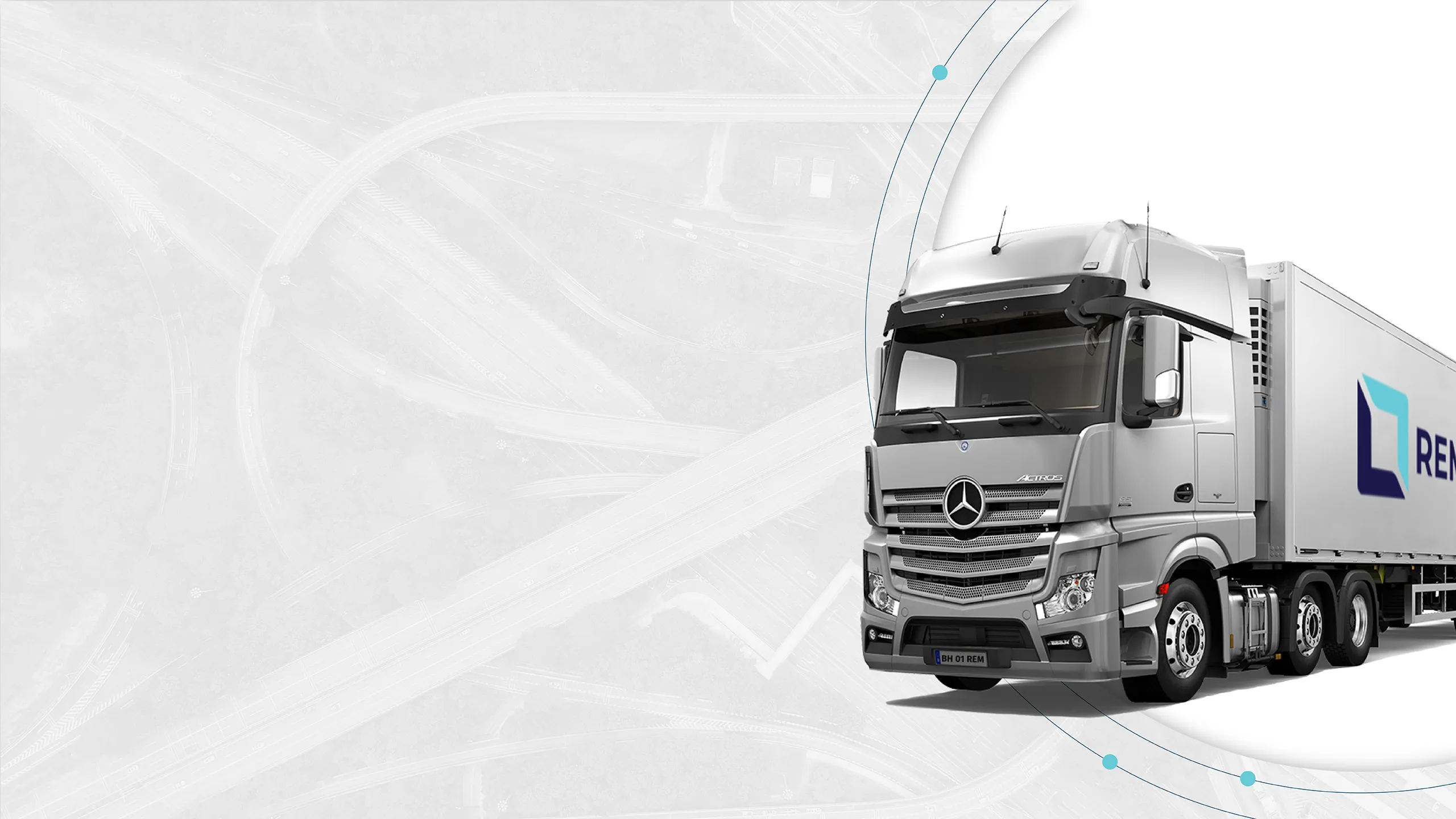 REM Group refrigerated Mercedes-Benz Actros truck on a motorway interchange